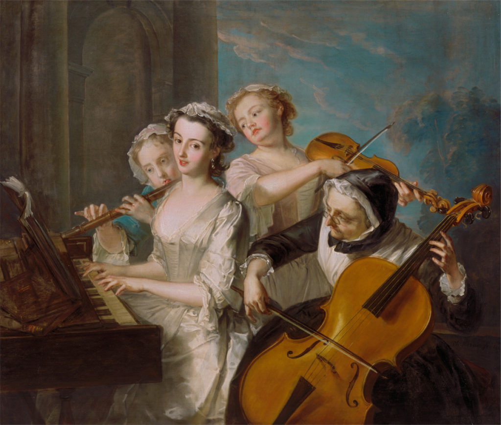Four 18th century women, wearing longsleeve lace dresses and caps, play a quartet together on flute, violin, cello, and harpsichord.