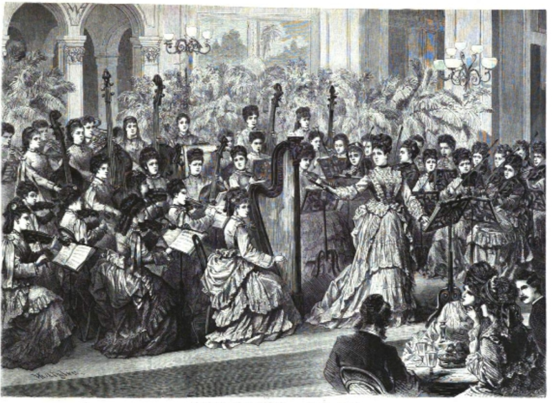 Josephine Amann-Weinlich stands onstage facing the audience, gesturing to present her all-women orchestra. The ladies onstage wear longsleeve white lacy dresses, with a row of potted palm trees behind them. A table with two men and two women from the audience is in the bottom right.
